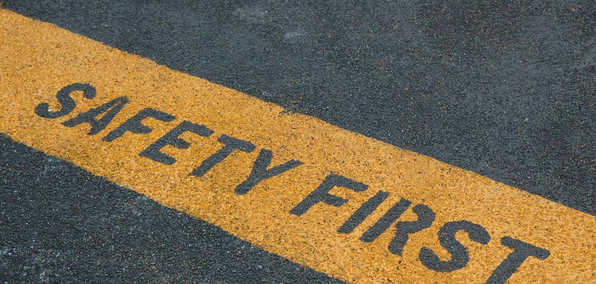 'Safety first' written on ground